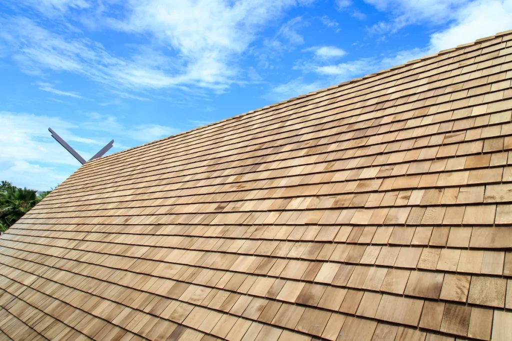 Wood shingles on house with blue sky straightlines